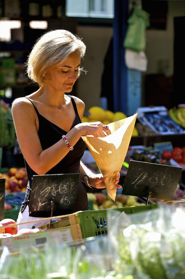 Blond woman shopping at a market