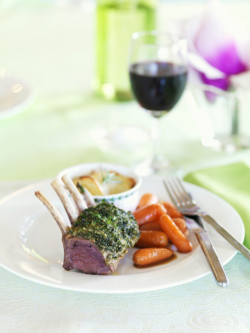 Rack of lamb with herb crust, potato gratin and carrots