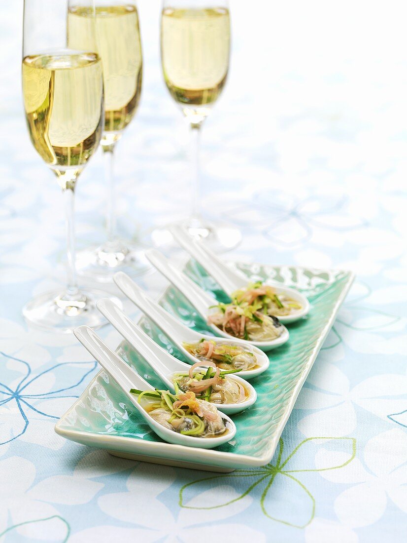 Oysters with Japanese dressing on spoons