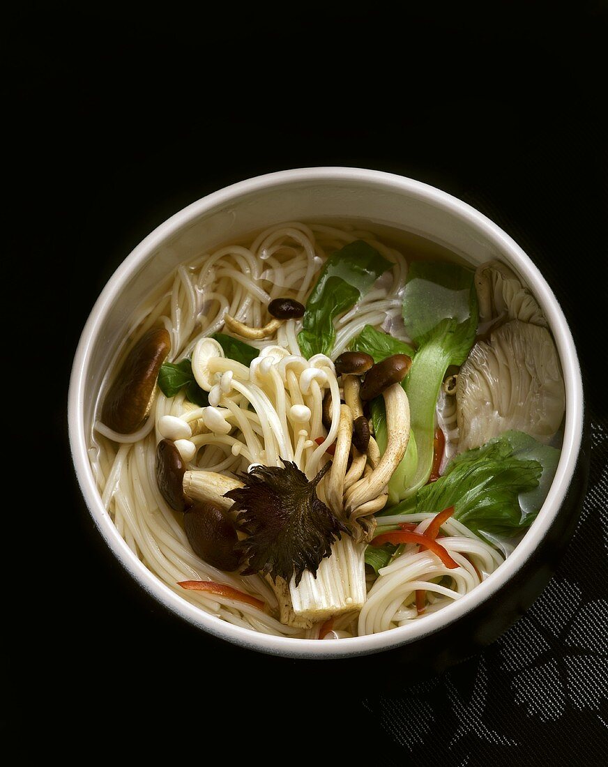 Asian noodle soup with mushrooms, pak choi and chilli