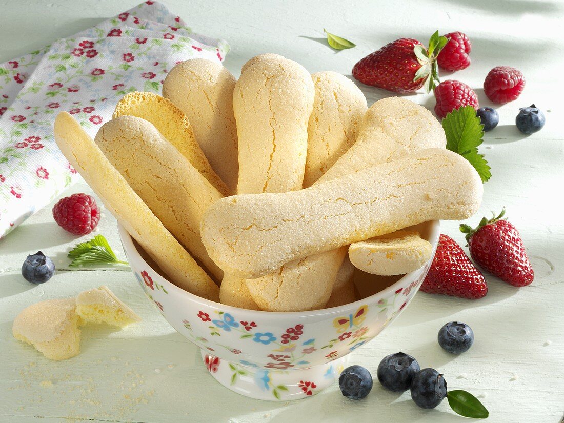 A bowl of sponge fingers and fresh berries