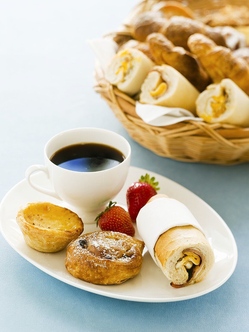 Pastries and bread rolls with coffee