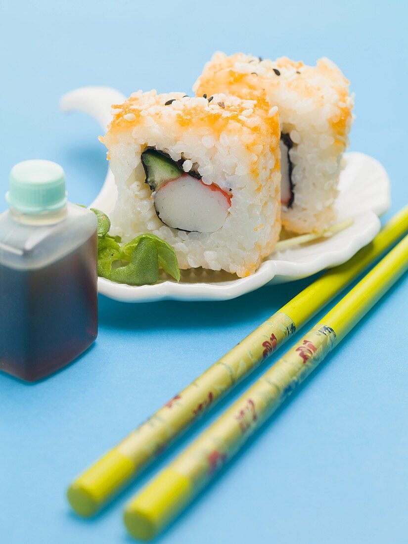 Inside-out rolls with soy sauce and chopsticks