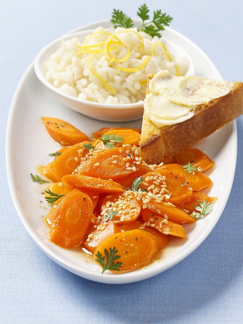 Buttered carrots with sesame seeds and lemon rice