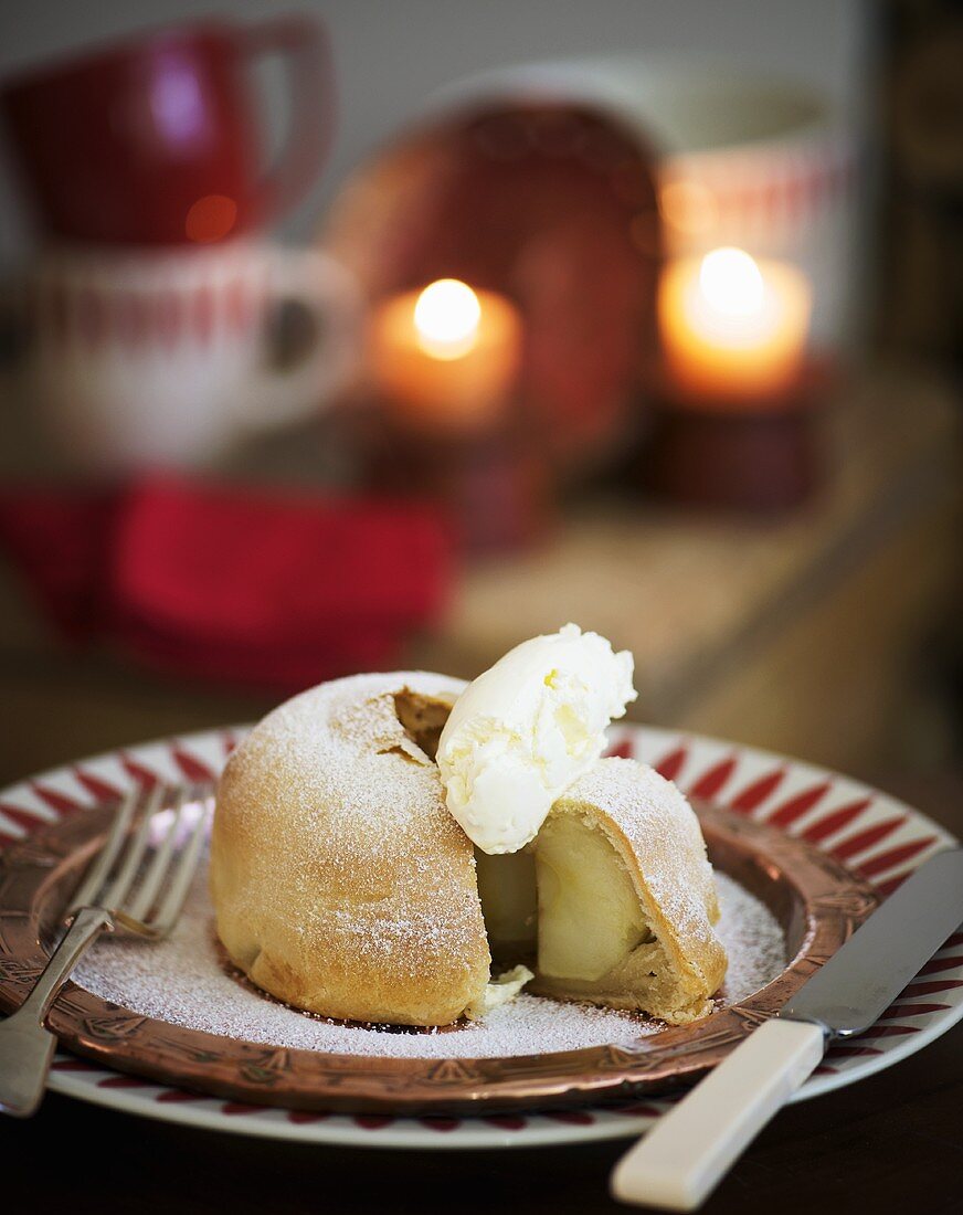 Apple dumpling (apple baked in pastry) with whipped cream