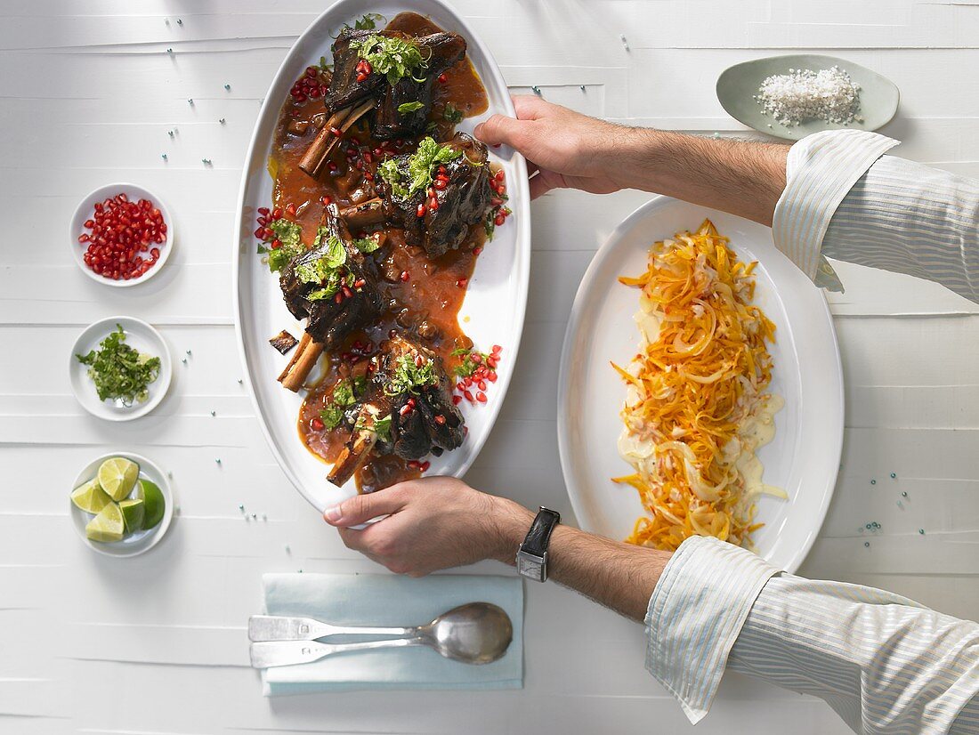 Braised lamb shanks with mint & lime gremolata & pomegranate seeds