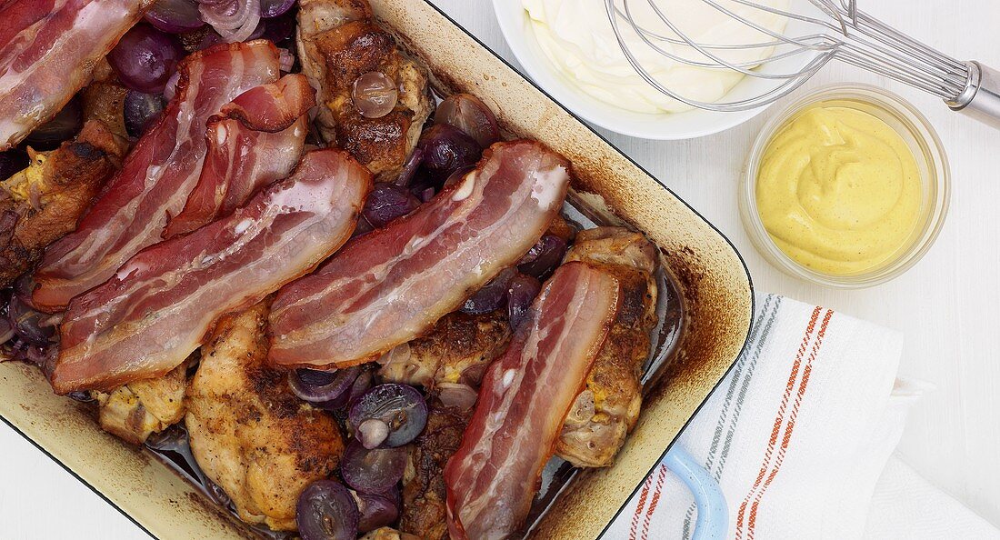 Rabbit with bacon and grapes in mustard sauce
