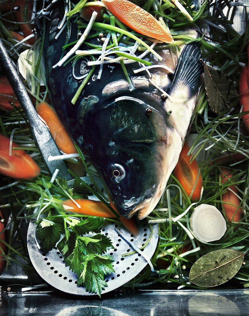 Carp on a bed of vegetables