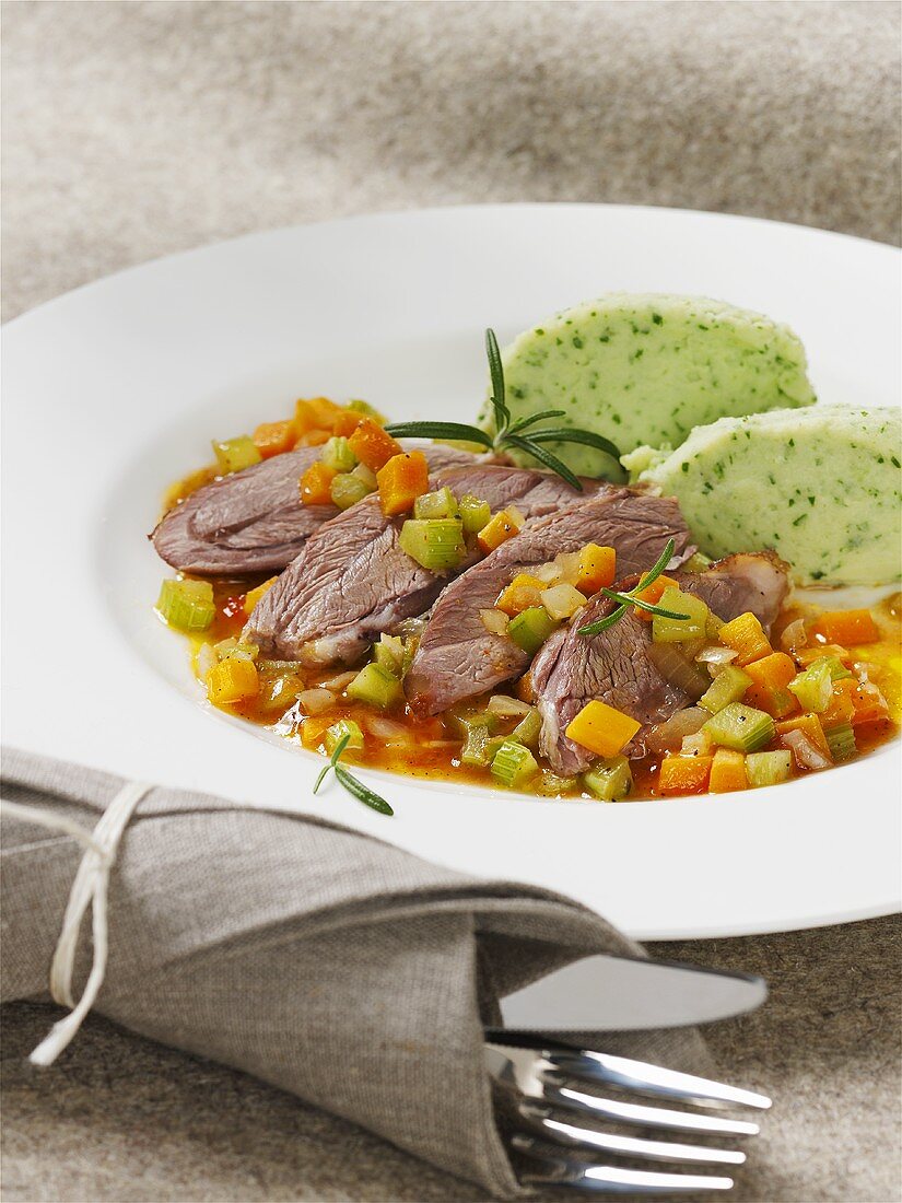 Lamb shank with diced vegetables and herb dumplings