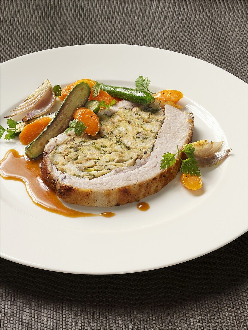 Stuffed roast veal with vegetables