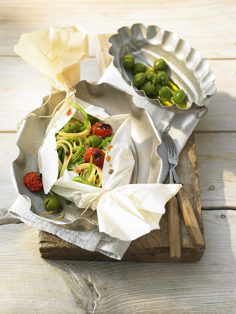 Pasta baked in paper with broccoli rabe and garlic