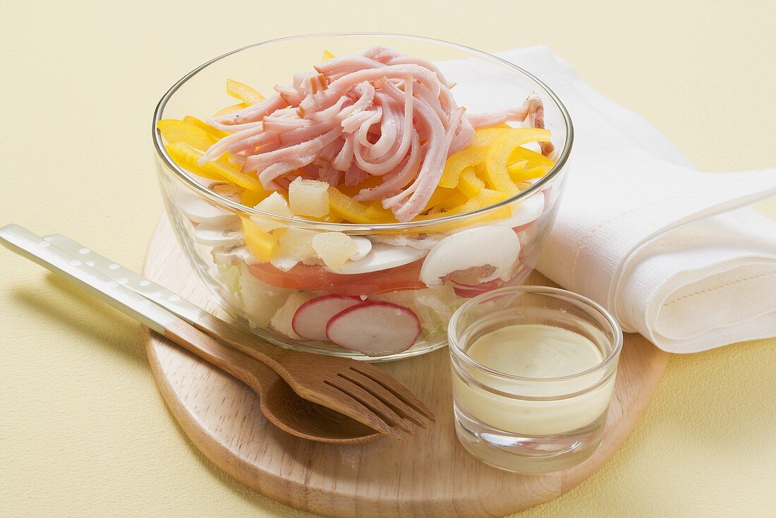 Layered salad with cured pork