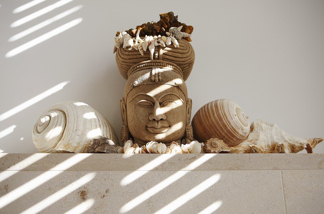 Buddha head with shells