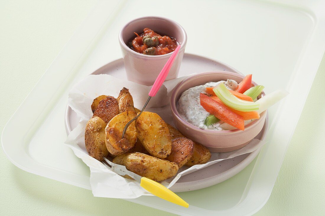 Roast potatoes and vegetable sticks with two different dips
