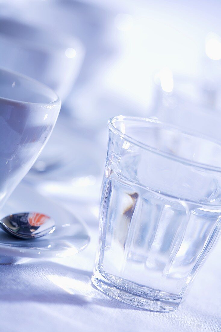 Espresso cups and glasses of water