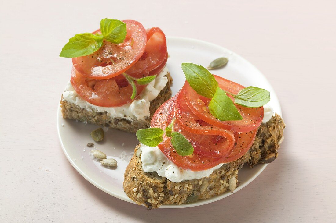 Tomatoes and soft cheese on bread
