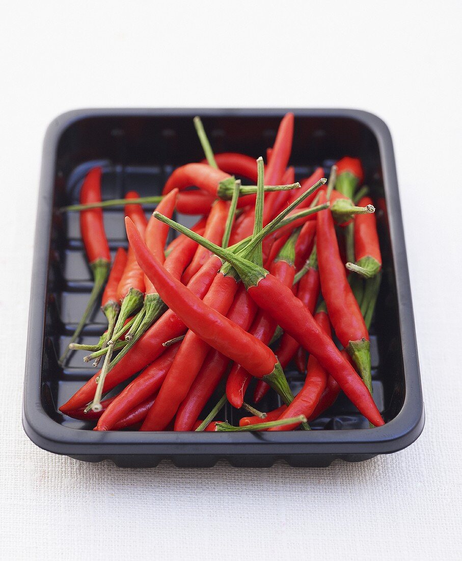 Thai Red chillies in a plastic tray