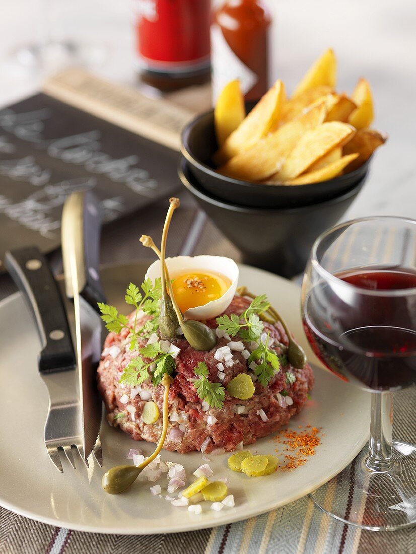 Beef tartare with egg yolk and chips