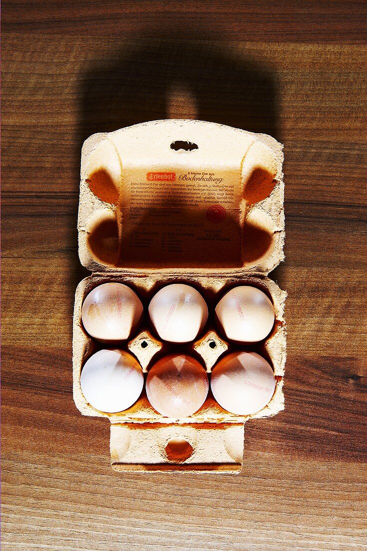 Eggs in egg box from above