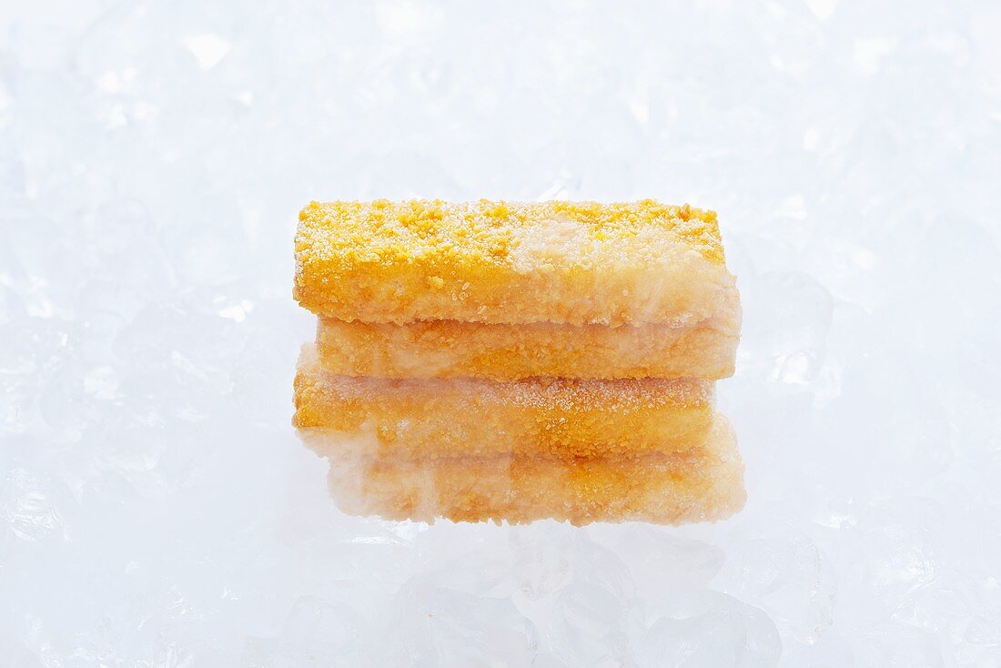 Frozen fish fingers on ice