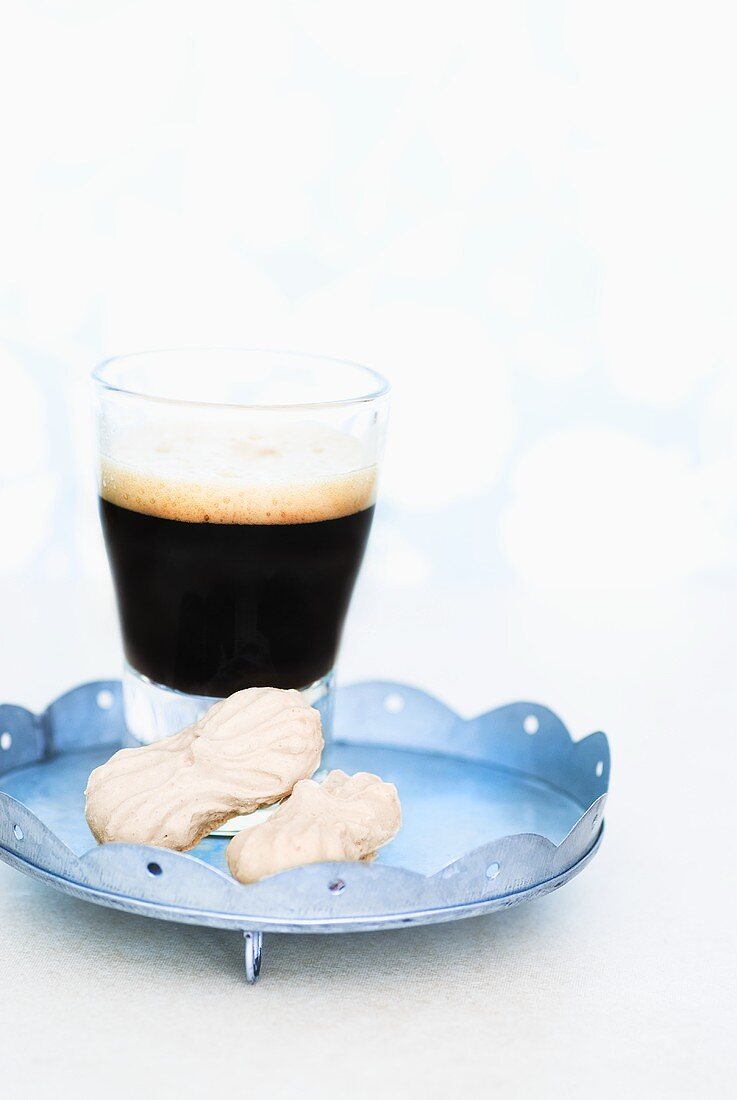 A glass of espresso with meringues