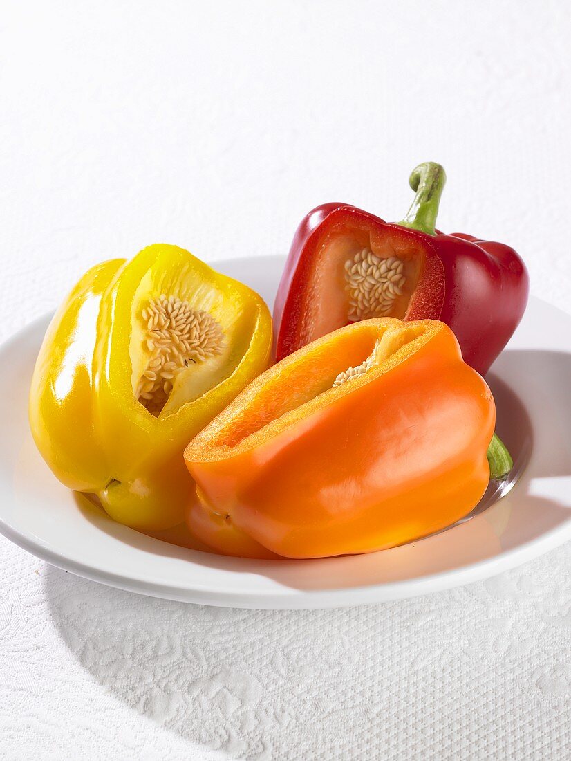 Three peppers, each with a section removed