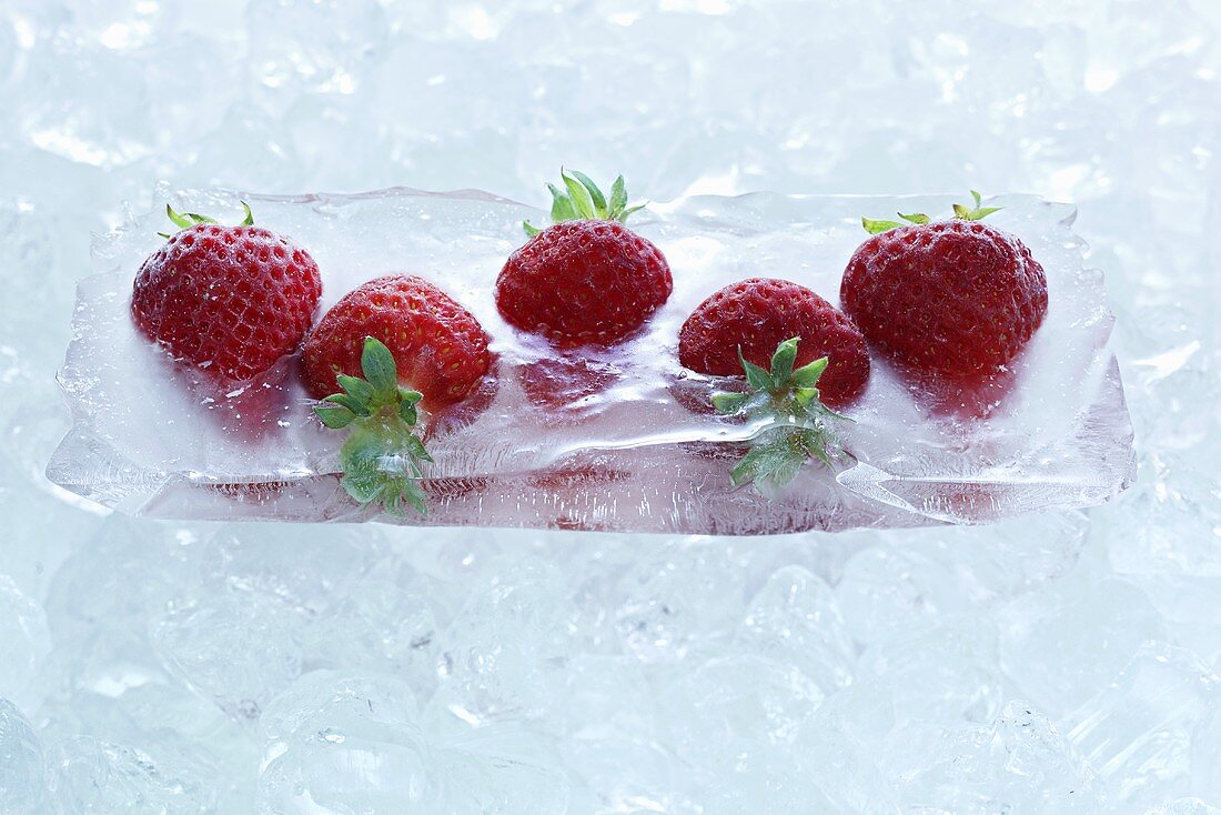 Strawberries frozen in a block of ice