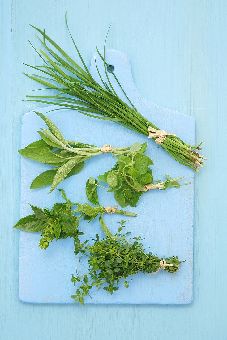 Various herbs on a chopping board