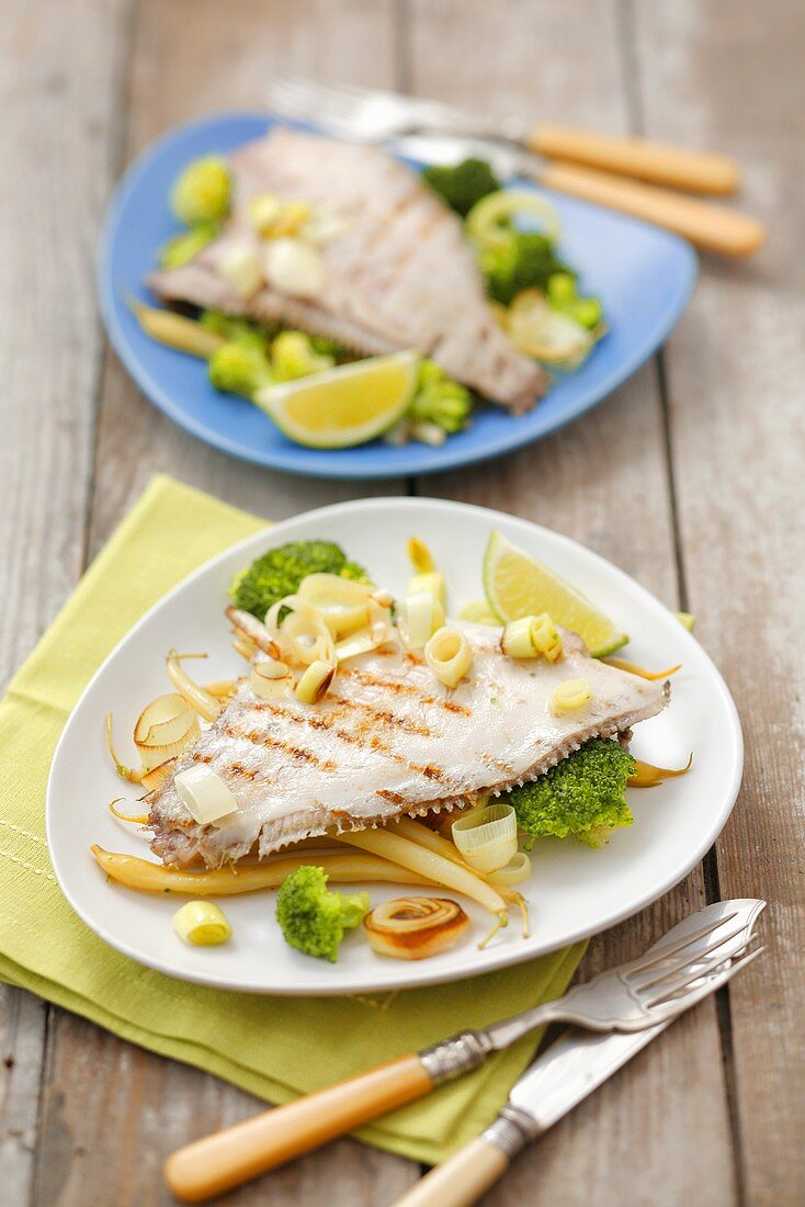 Grilled plaice on broccoli, leeks and yellow beans