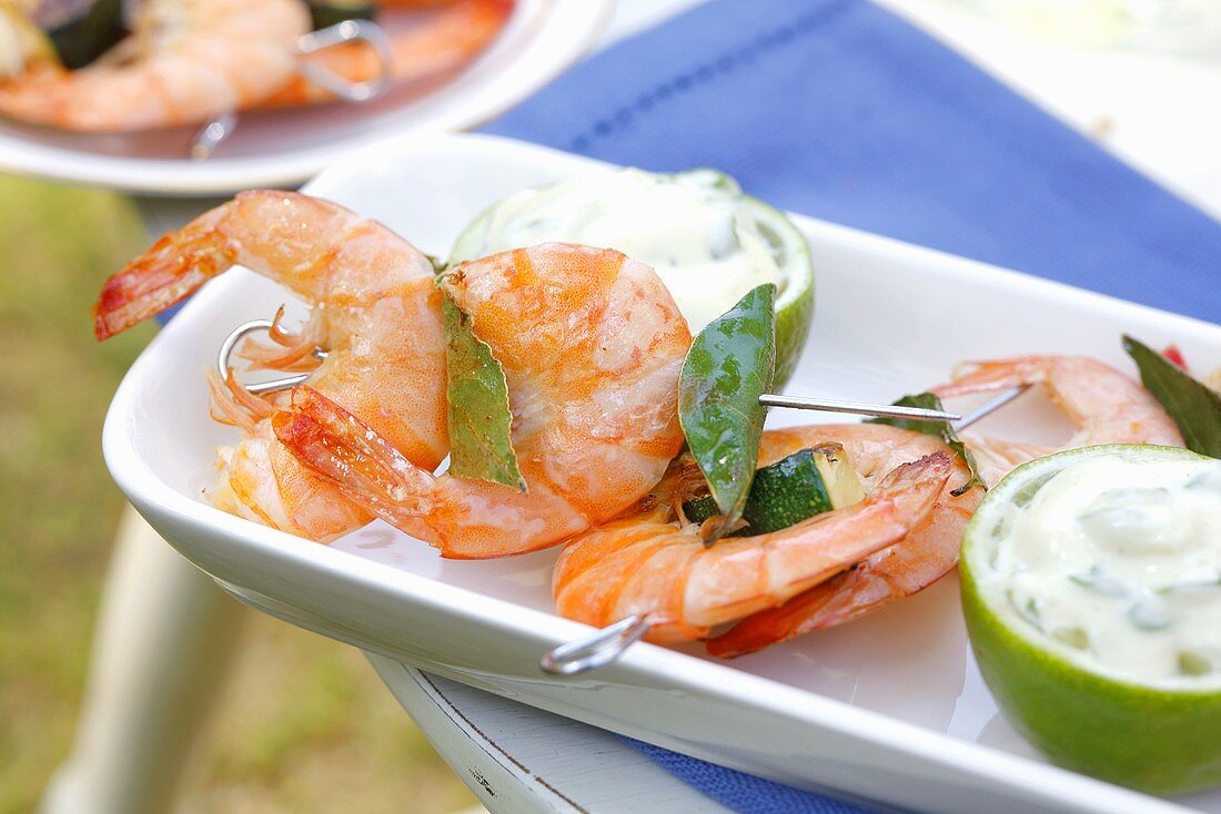 Grilled prawn skewers with bay leaves and lime mayonnaise
