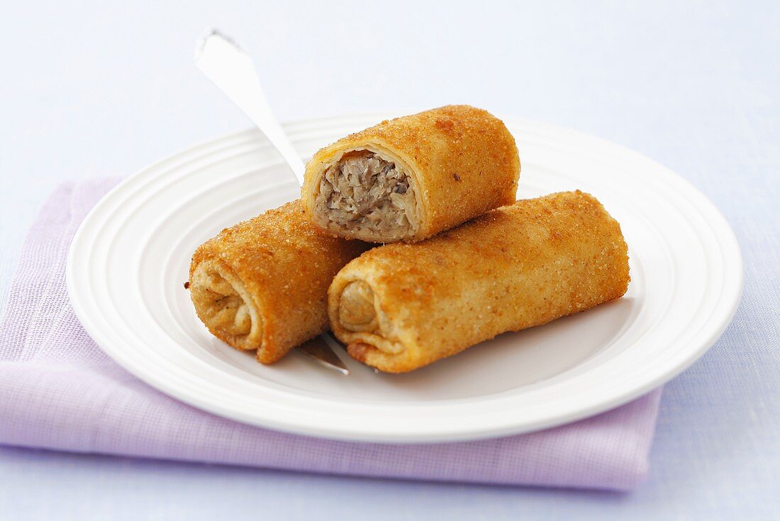 Deep-fried pastry rolls filled with sauerkraut and mushrooms