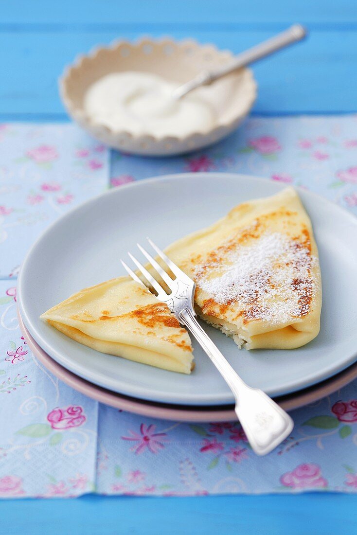 Crêpe filled with soft cheese and dusted with icing sugar
