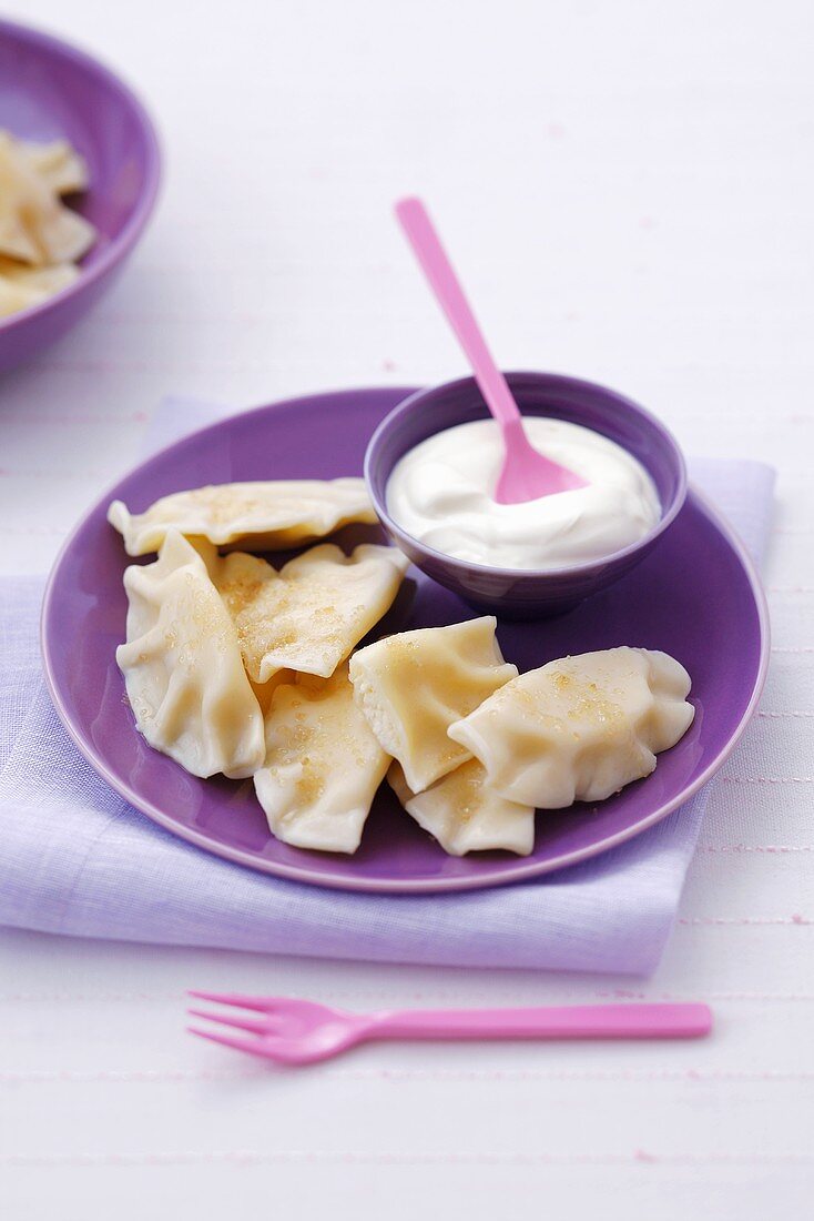 Pasta parcels with cottage cheese filling, raisins, cream, Poland