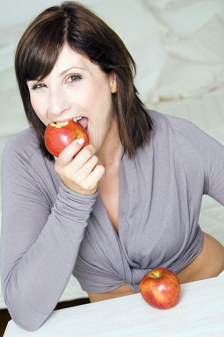 Woman eating an apple