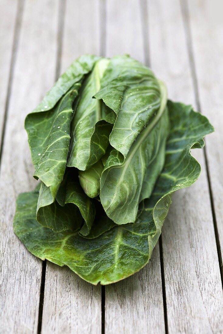 Pointed cabbage on wooden table