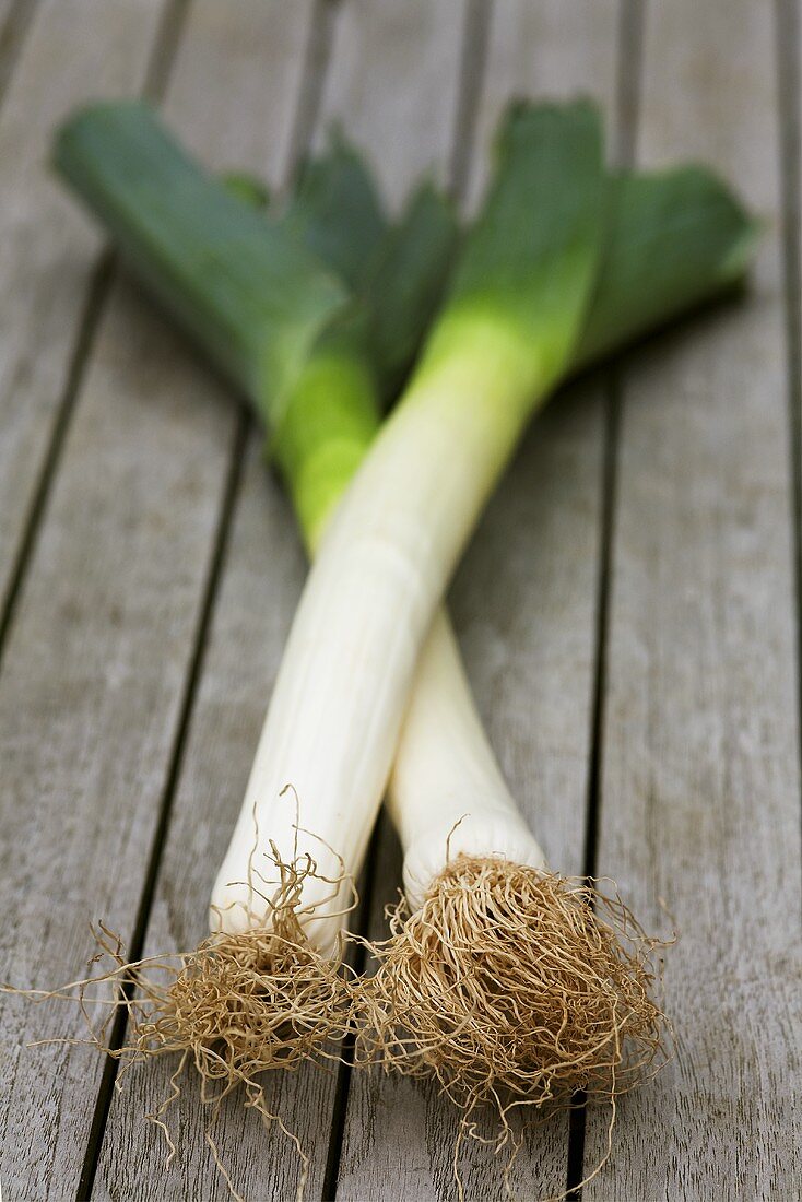 Leeks on wooden table