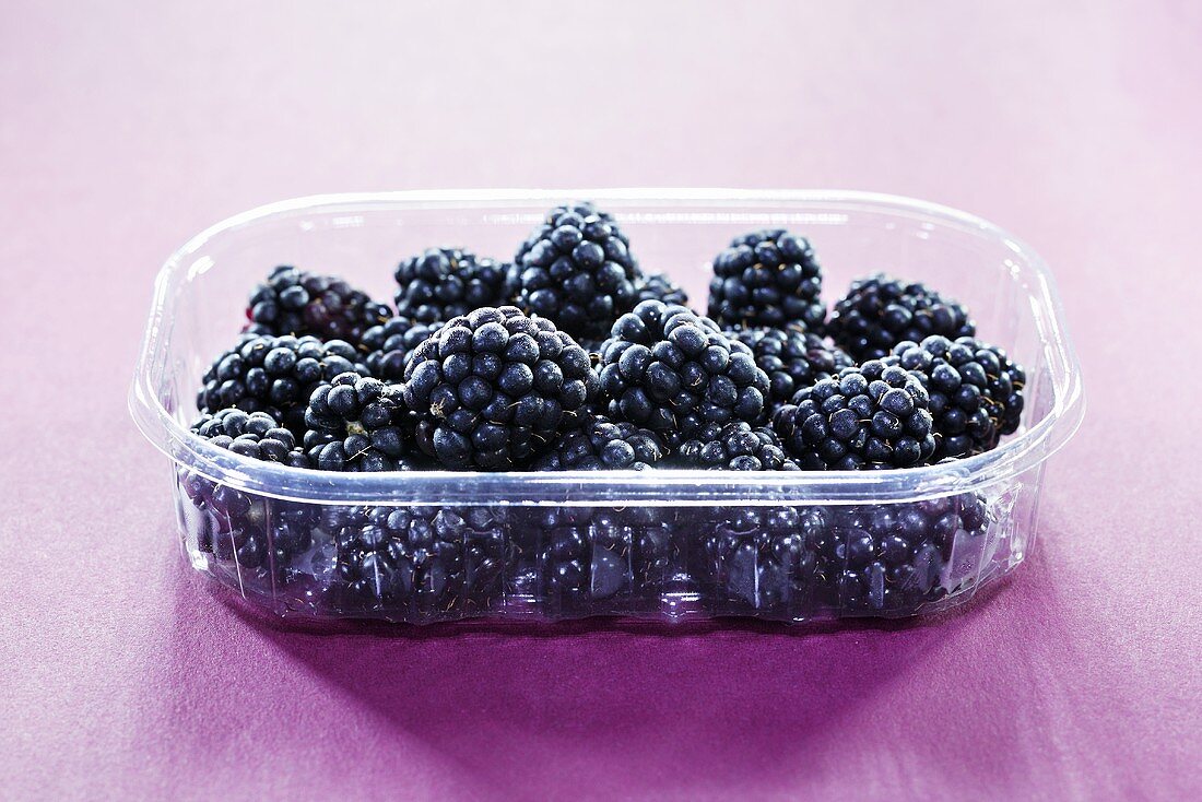 Blackberries in plastic container