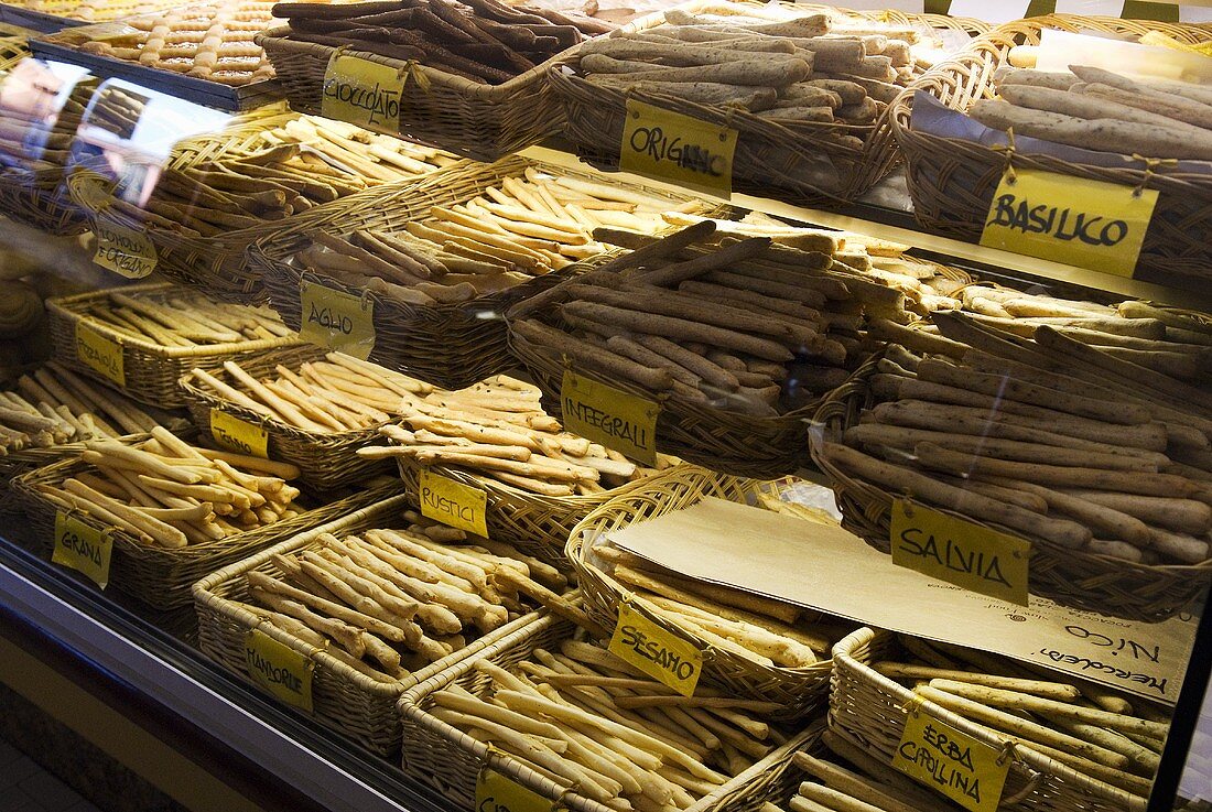 Various types of grissini in a baker's shop (Italy)