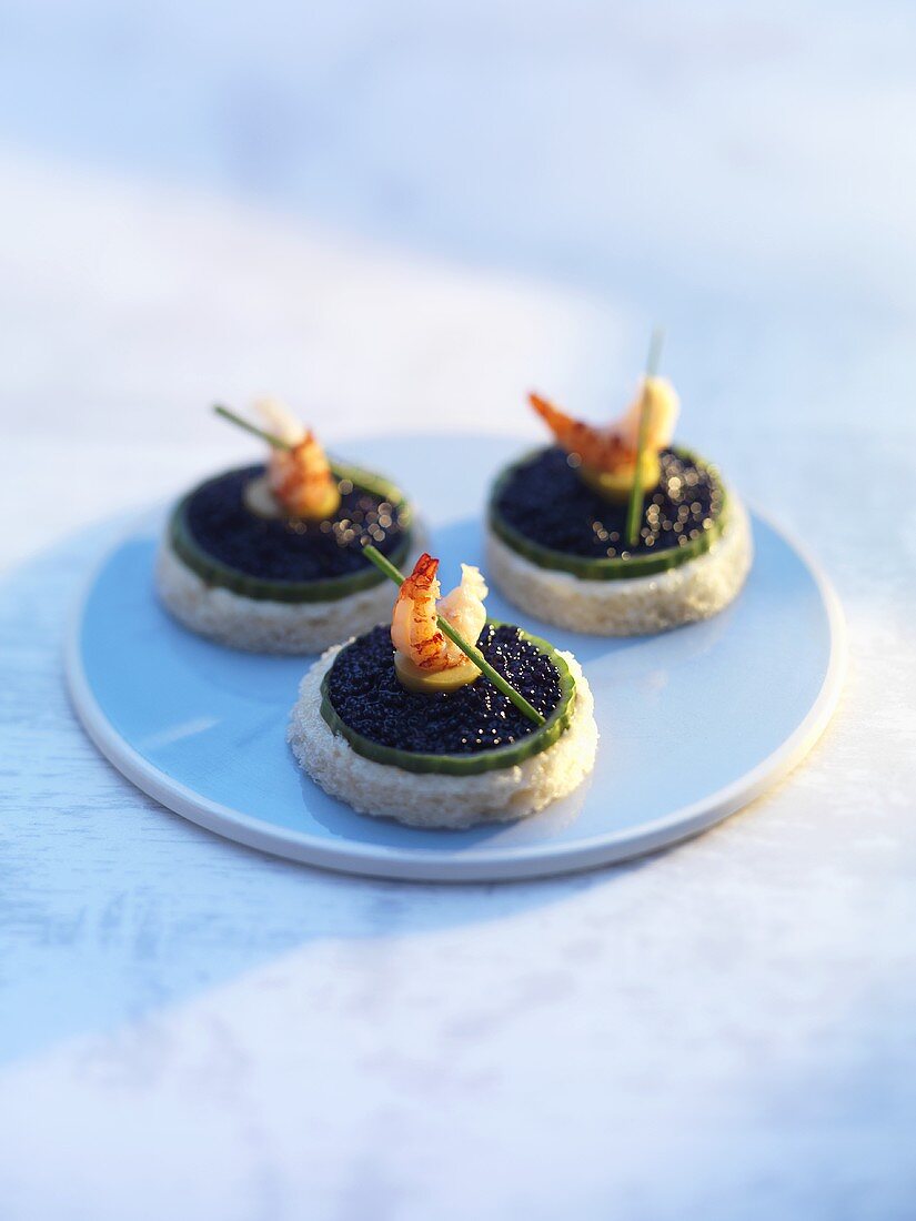 Cucumber, caviar and prawn canapés