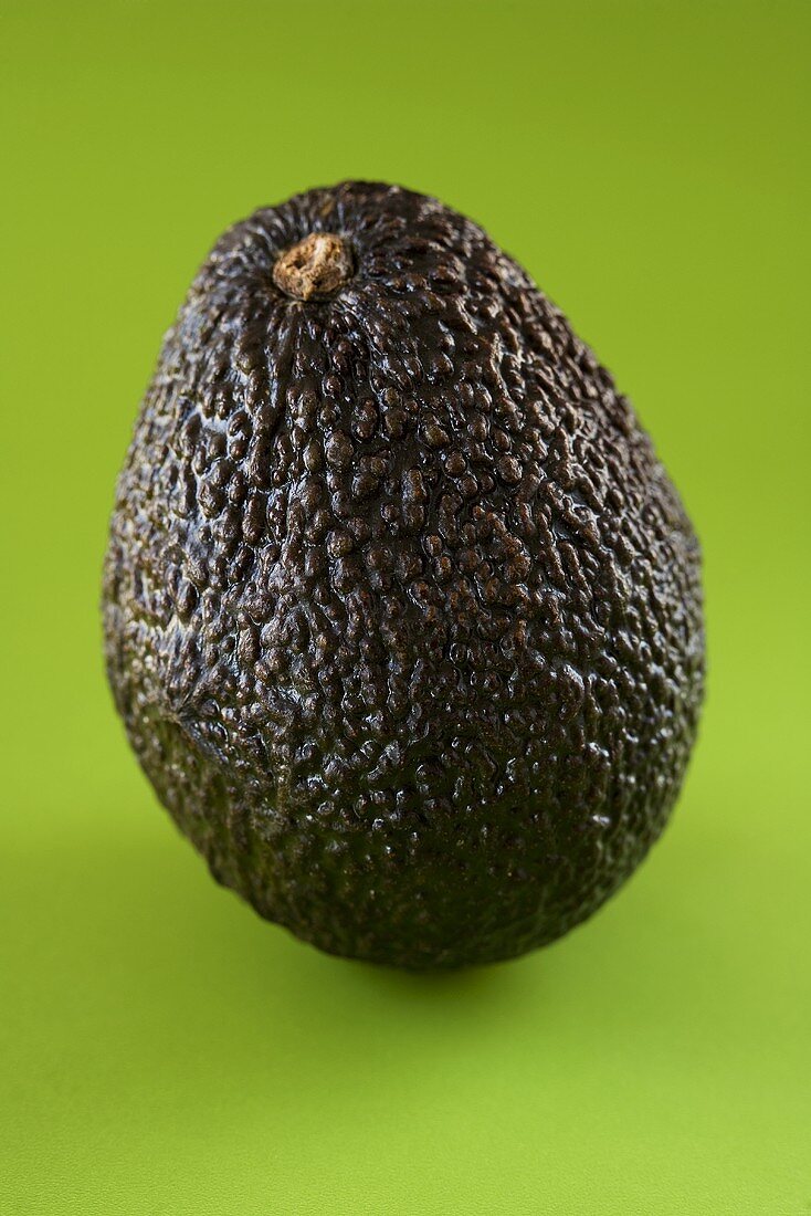 Avocado on green background