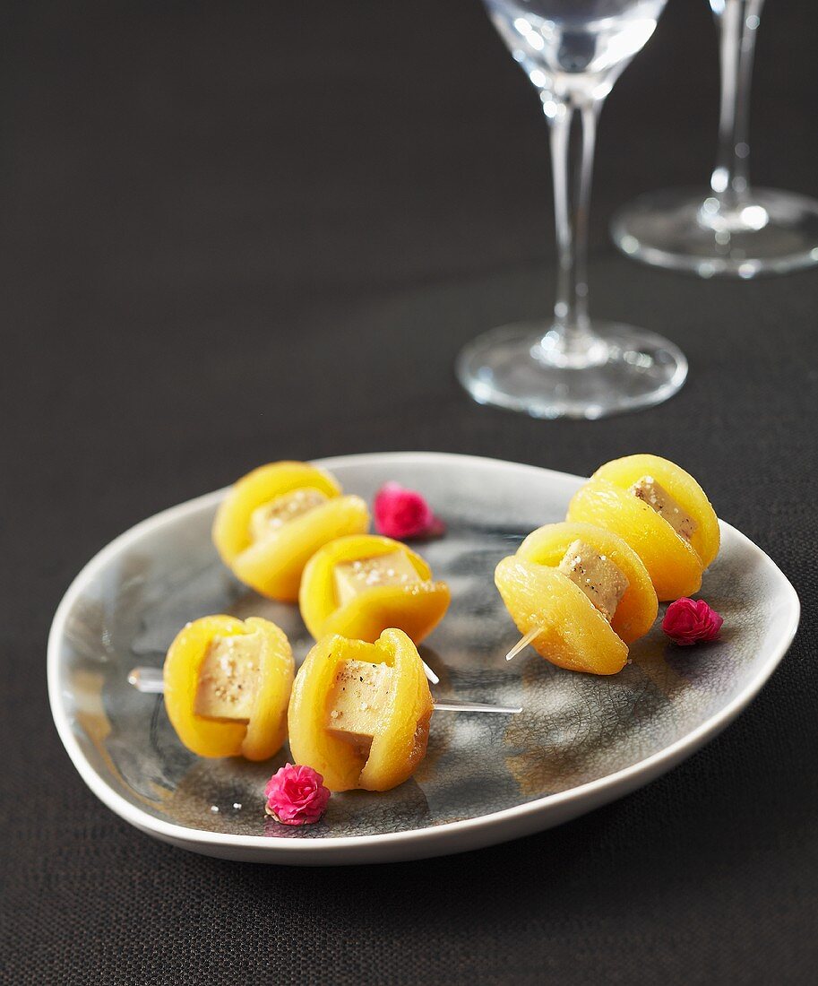 Dried apricots with goose liver on cocktail sticks