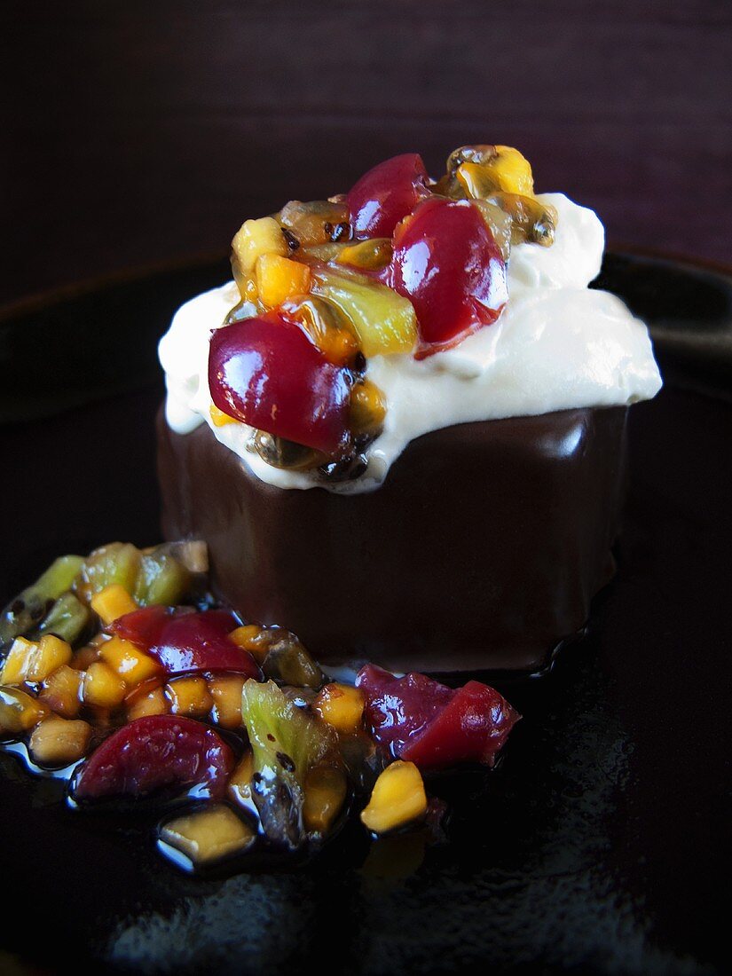 Chocolate cake with fruit and cream