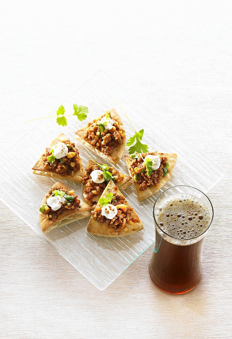 Lamb, pine nut & yoghurt appetisers, glass of Long Island Iced Tea