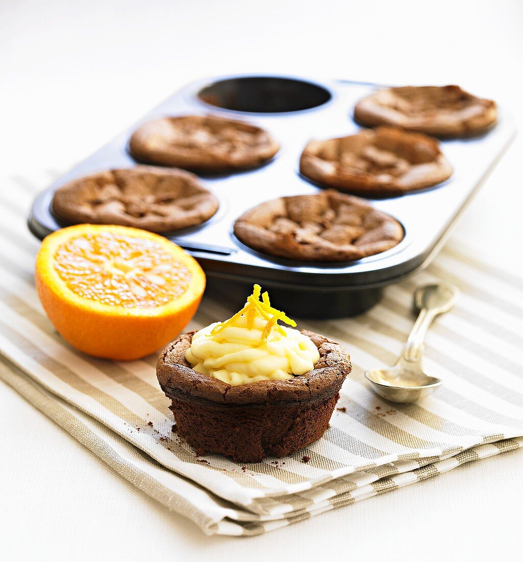 Chocolate muffins with orange cream