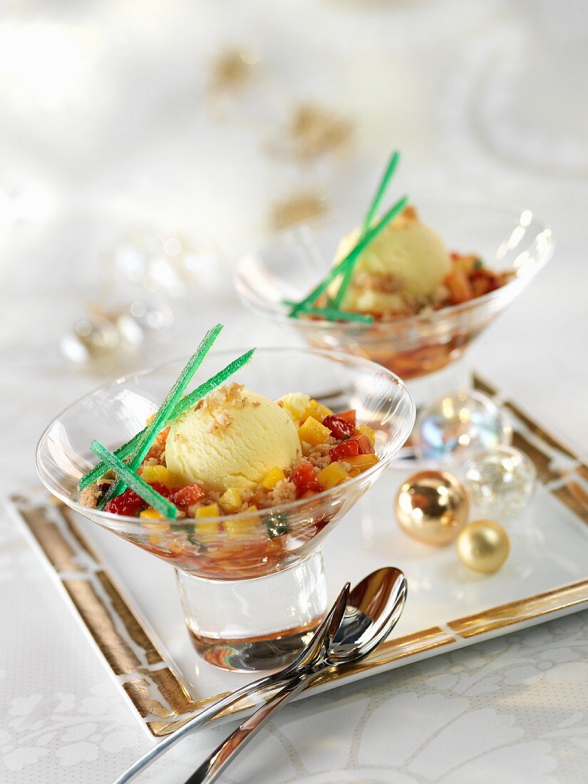 Fruit salad with ice cream and ginger and coconut sprinkles