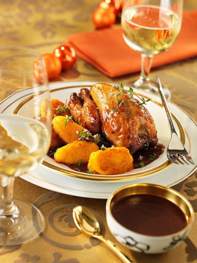 Poussin in chocolate sauce with potato croquettes