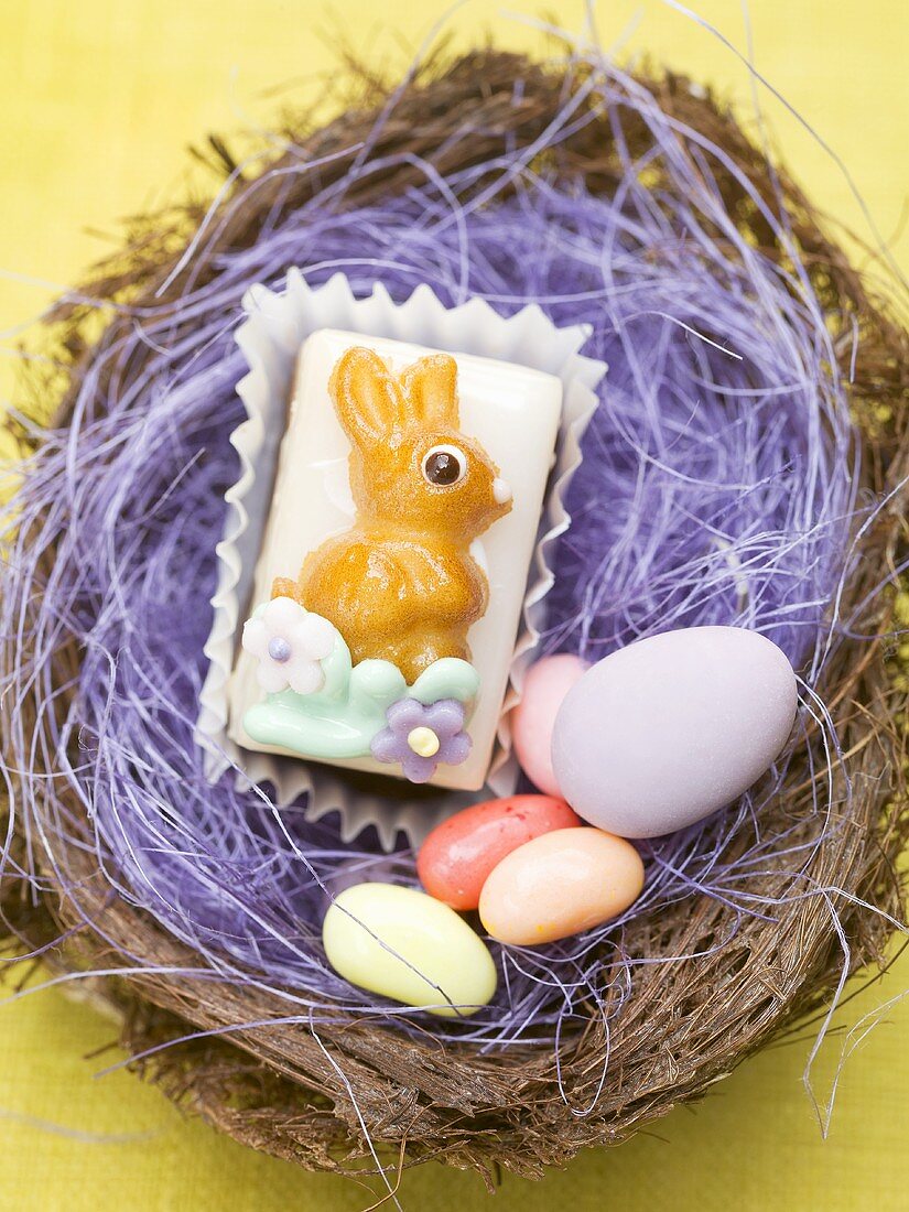 Petit four and sugar eggs in Easter nest