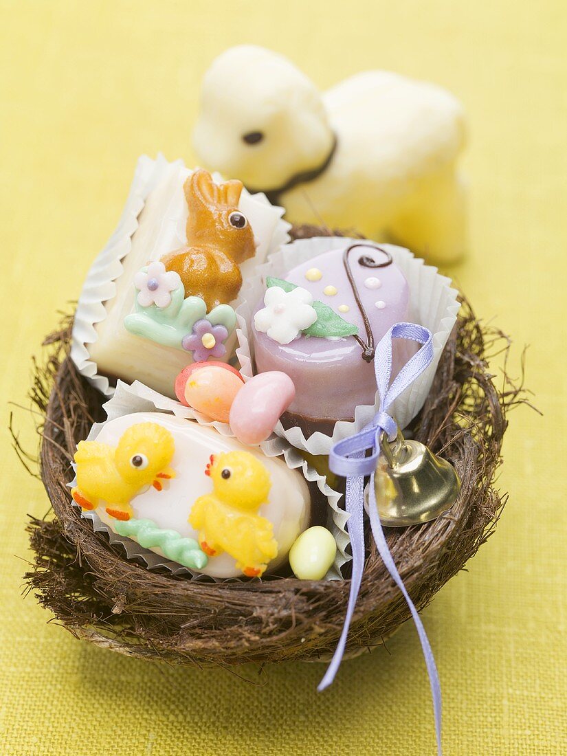Petit fours and sugar eggs in an Easter nest