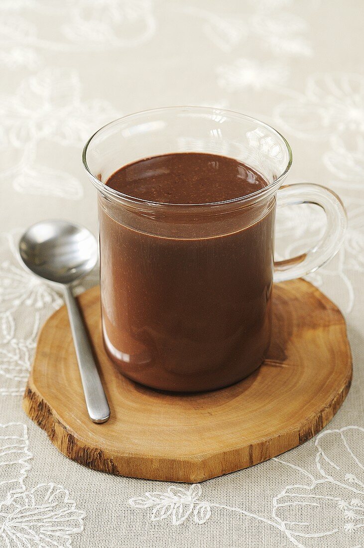 A glass cup of hot chocolate