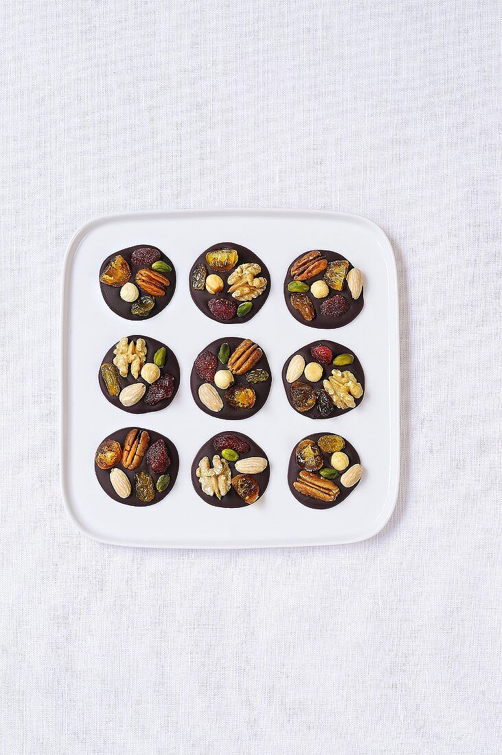 Mendiants with nuts & dried fruit (Chocolate discs, France)